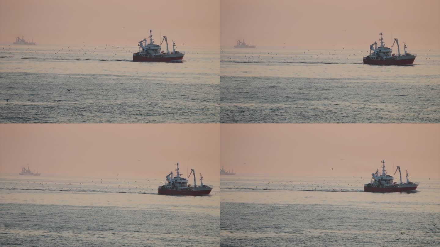 平静的北海日落时分的渔船