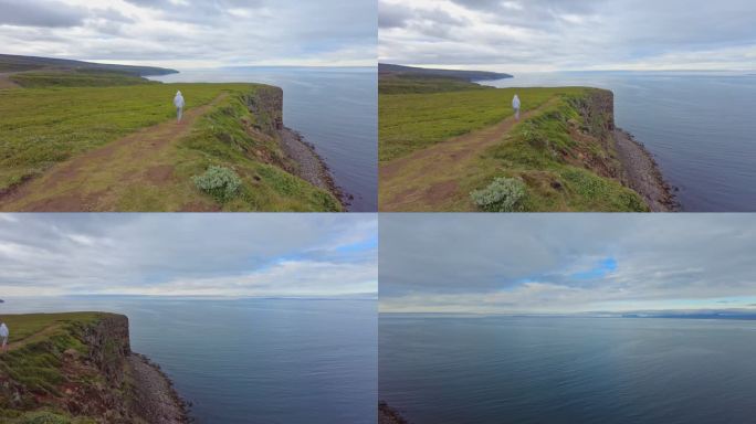 冰岛北部Jökulsárgljúfur海湾上的悬崖上行走的少年男孩
