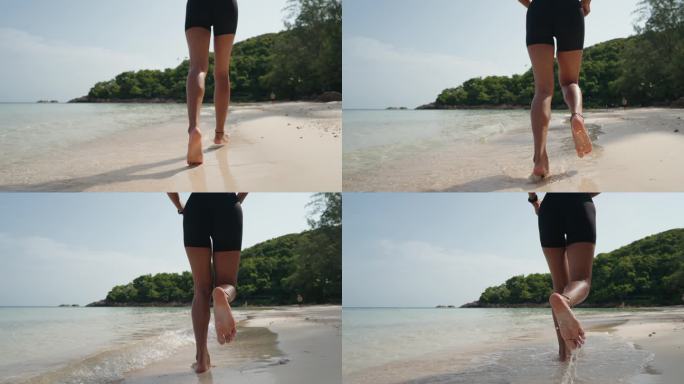 海滩上慢跑的女人背影海边优美