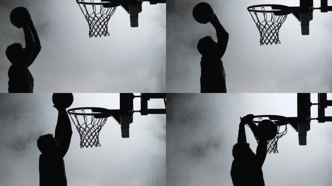SLO MO的剪影篮球运动员扣球