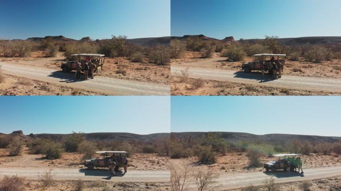 Safari旅行团在阳光明媚的风景中返回车辆