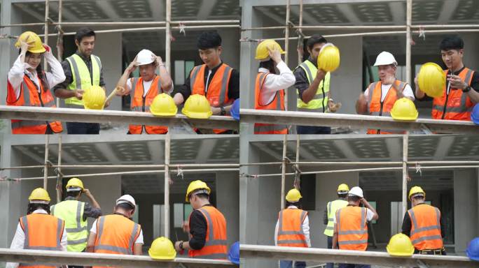 蓝领工人正在建筑工地与同事一起工作。