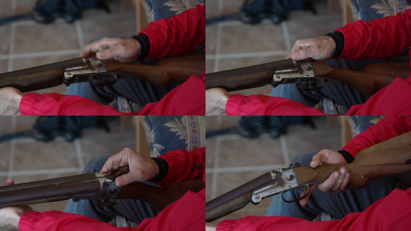 男子手持老式棕色金属猎枪