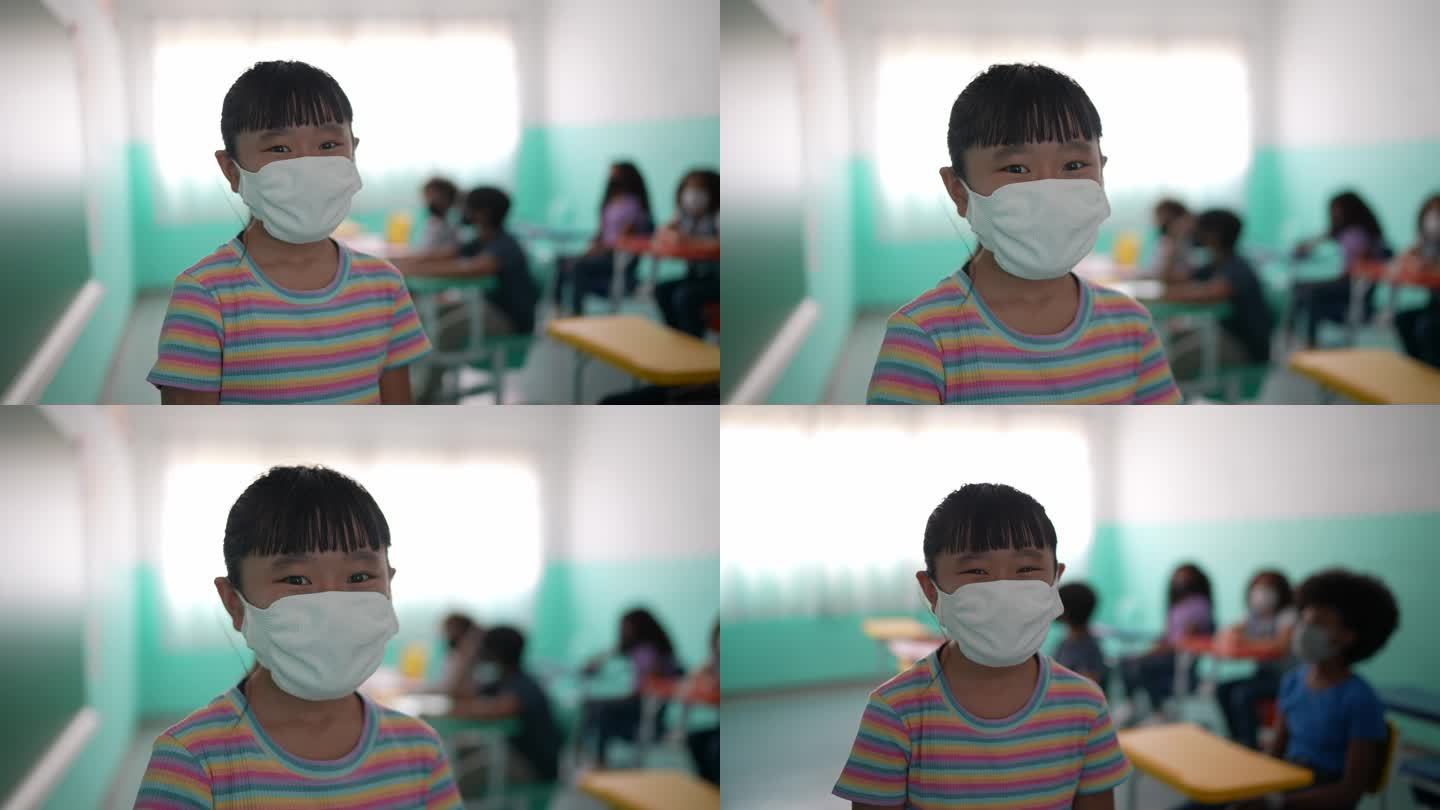 一个女孩在教室里戴口罩的照片