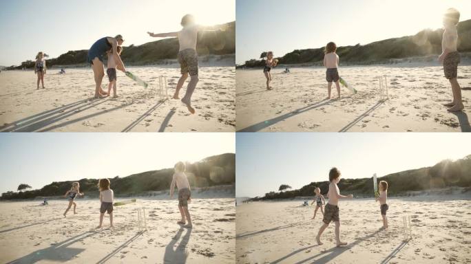海滩上的板球玩耍母亲指导童年时光