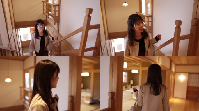 在日本龙冈酒店，女游客走上楼梯，进入日式榻榻米房间