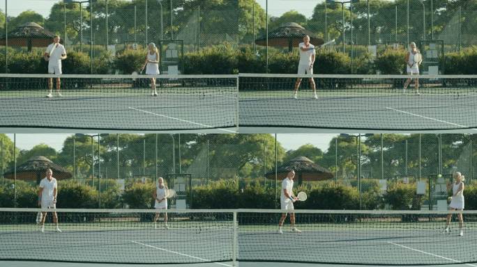 一对老年夫妇在网球场上打双打