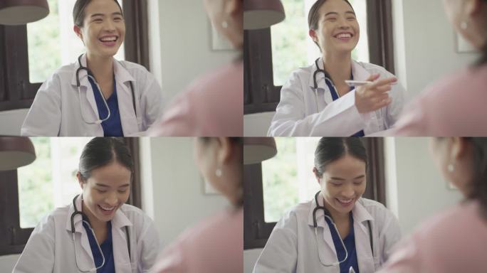 女医生咨询。女医生大笑开心与病人交流沟通