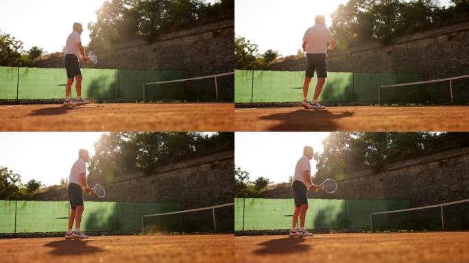 资深网球运动员和教练，在室外红土网球场练习网球