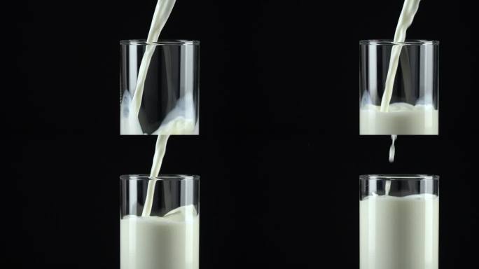 慢镜头：将牛奶倒入黑色背景的玻璃杯中。