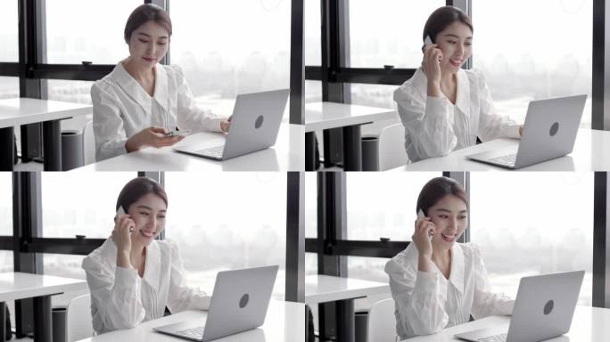 年轻快乐迷人美丽的亚洲女性员工在手机上谈笑风生