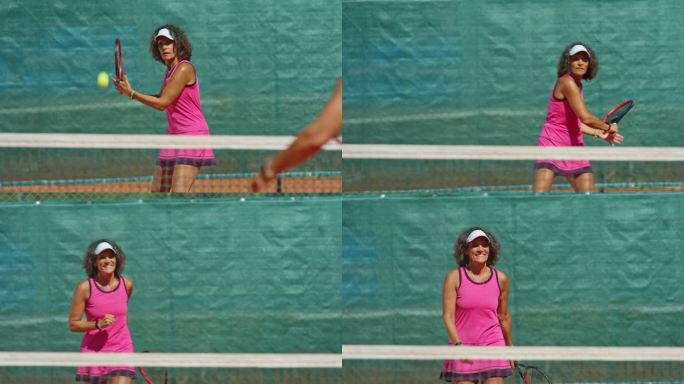 SLO MO女子在阳光下打网球，赢得一盘时面带微笑