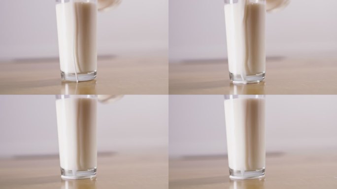 MS将牛奶洒在玻璃杯上