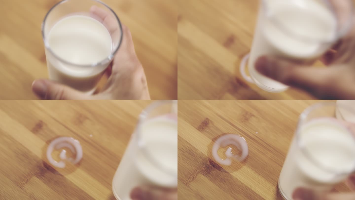 R/F手在桌子上移动一杯牛奶