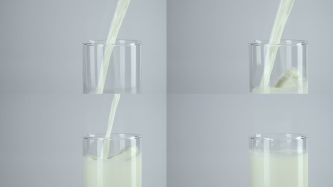 慢镜头：将牛奶倒入白色背景的玻璃杯中。