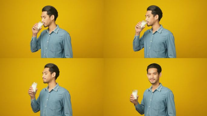 亚洲年轻男子站在孤立的黄色背景下喝牛奶，《食物与饮料》，《人与健康的生活方式》