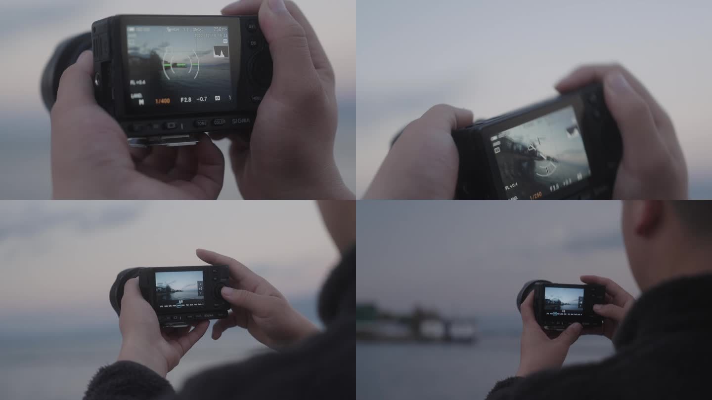 手拿相机拍海 数码相机 sigma相机
