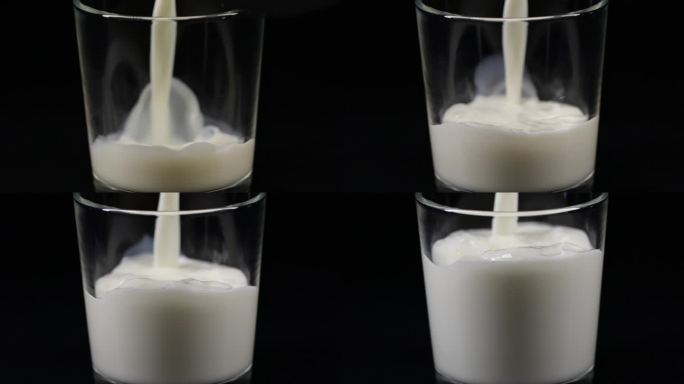 倒牛奶慢动作牛奶倒入玻璃水杯黑色背景广告