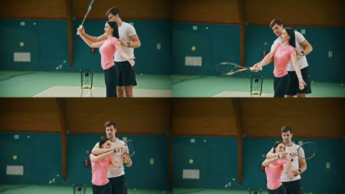 年轻的男教练在球场上教女子网球