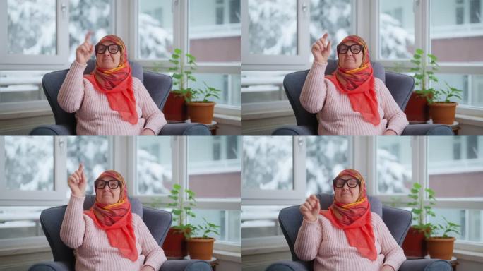 穆斯林妇女戴着智能眼镜听音乐或播客
