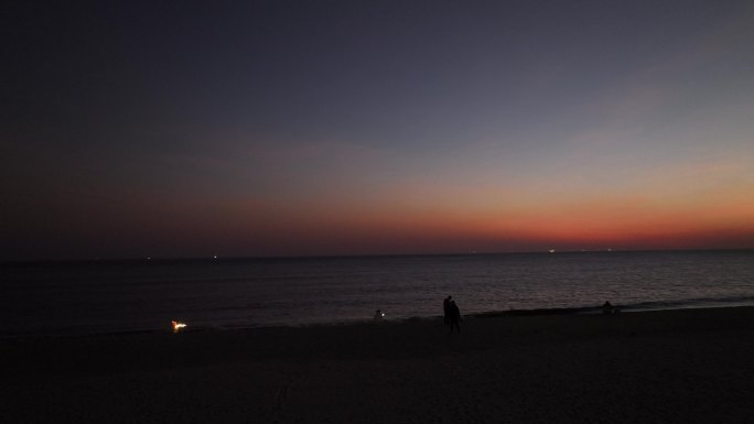 夕阳海边落日剪影烟花