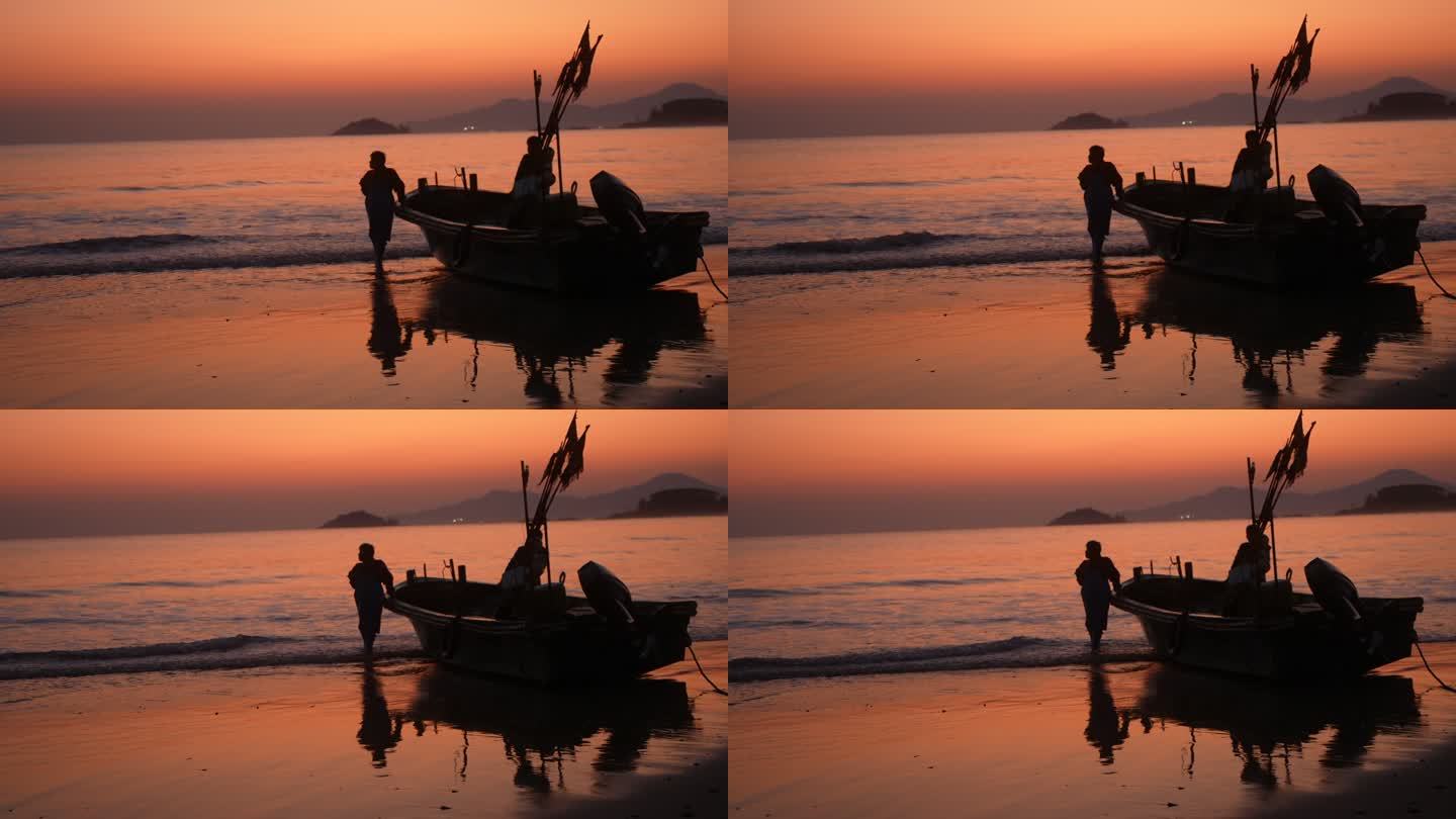 海边夕阳落日渔船渔民剪影