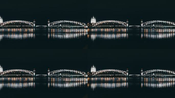 圣彼得堡-涅瓦河的主河夜景令人惊叹，有灯光照明的吊桥，车在上面行驶