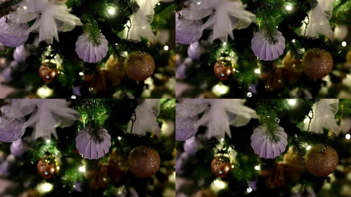 用漂亮的装饰品装饰圣诞树。