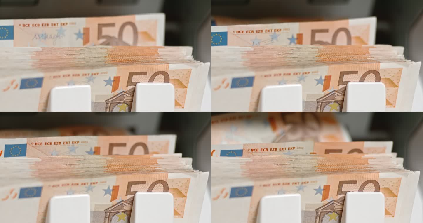 SLO MO LD 50欧元钞票从货币柜台出来并堆积起来