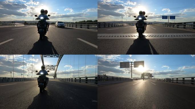 蓝天下情侣骑摩托跨过大桥