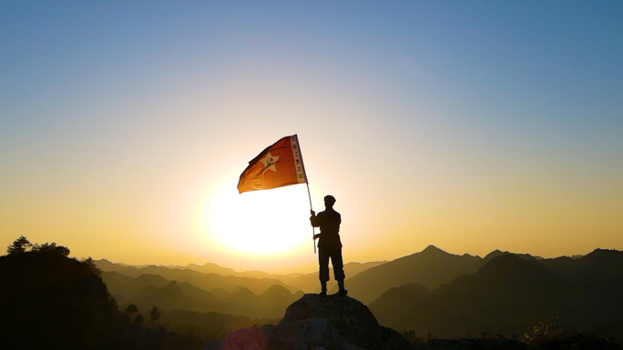 山顶挥舞旗帜工农红军军旗爱国教育红色革命