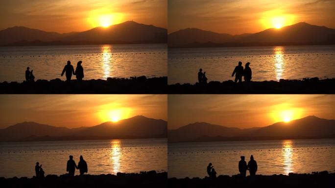 【4K】一对情侣在海边日落行走