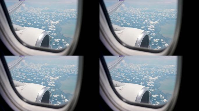 泰国南部普吉岛的空中窗户飞机在蓝天下的云层上空飞行。从飞机的窗口观看天空。