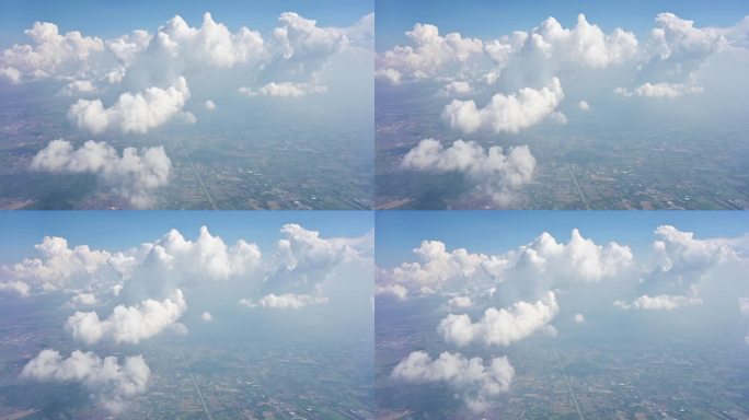 空中场景景观在蓝天的云上飞行。从飞机的窗口观看天空。