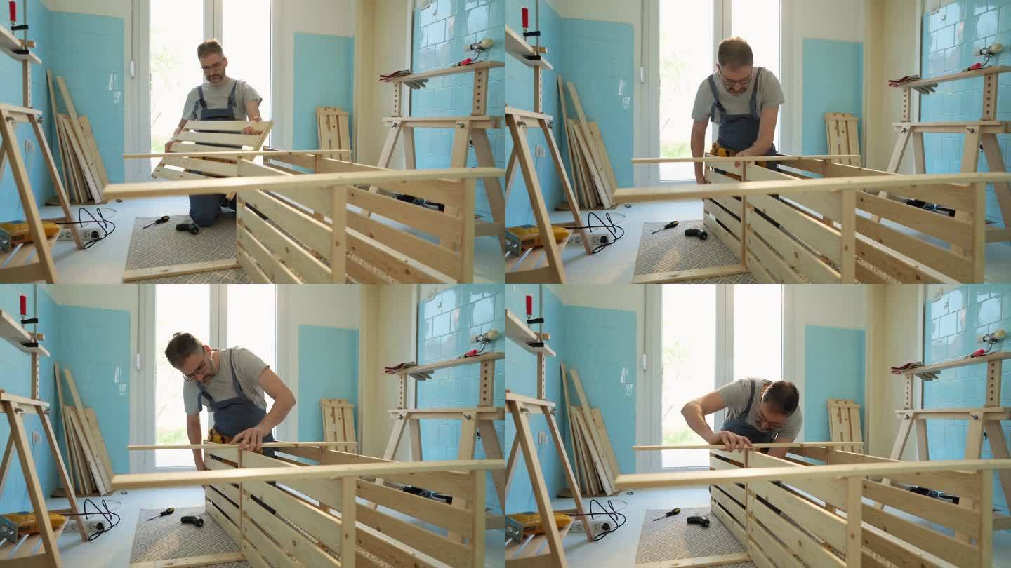 高加索男性木匠在厨房组装木架子
