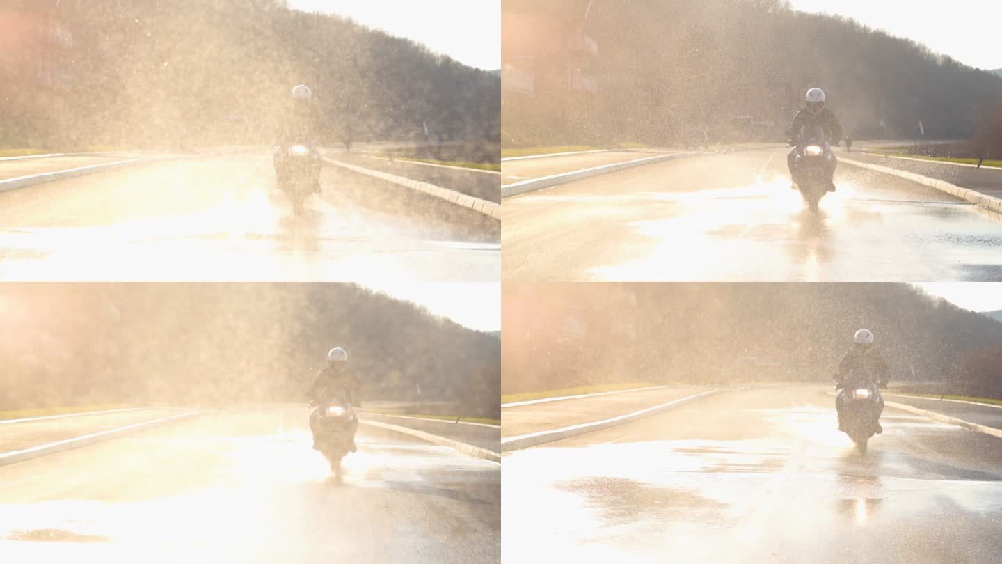 摩托车在水中骑行摩托车公路行驶溅起水花积