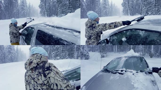 一名妇女用刮冰器从车上扫雪