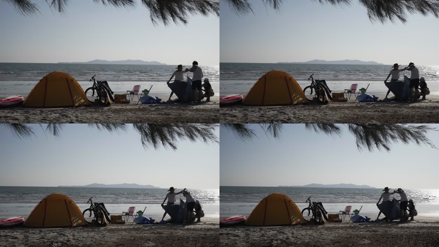 一群朋友在海边露营。