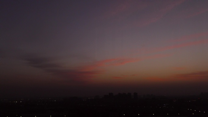 城市落日夕阳西下晚霞城市夜景夜幕降临傍晚