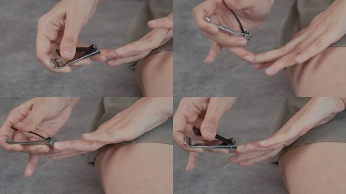 一名亚洲妇女在家用指甲刀手动剪指甲