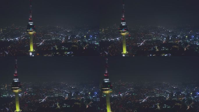 鸟瞰首尔市中心的N首尔塔天际线，夜晚在韩国首尔市的南山山上有灯光小道。