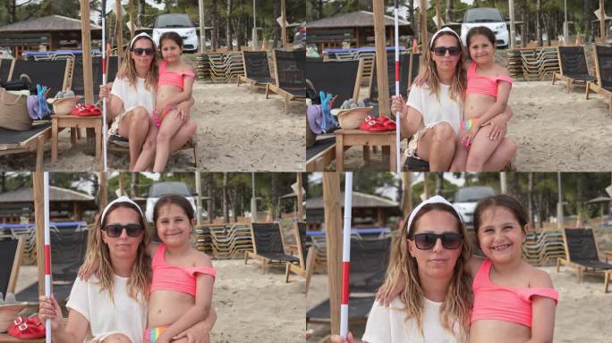 海滩上失明的白人母亲和女儿的肖像