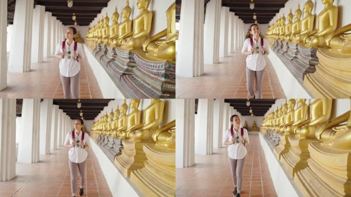 年轻女子探索古老的佛教寺庙
