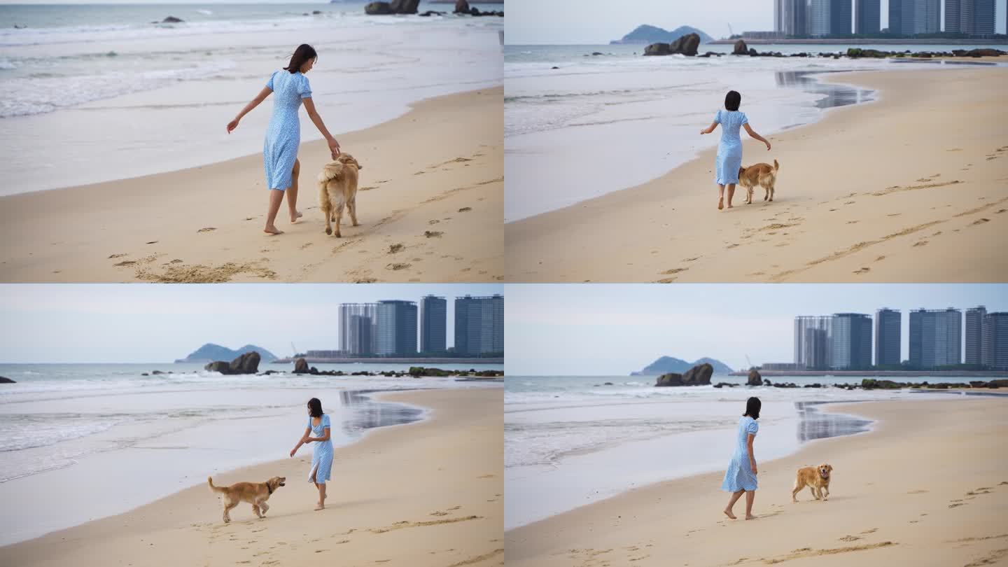 女孩和狗狗在海边沙滩上游玩