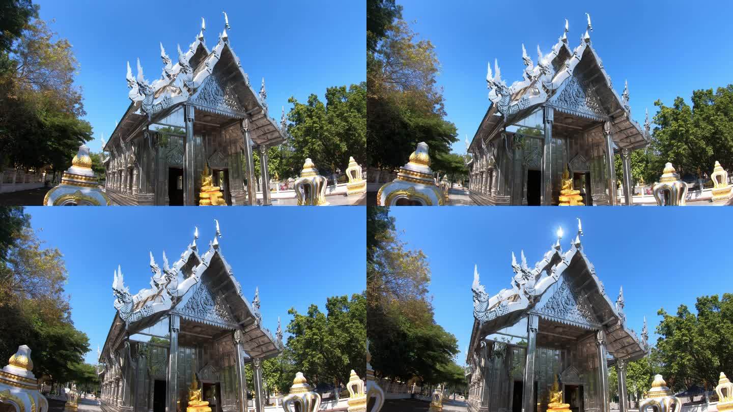 一名男性游客探索泰国寺庙的后视图。