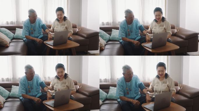 老年夫妇在家里用笔记本电脑与医生视频会议