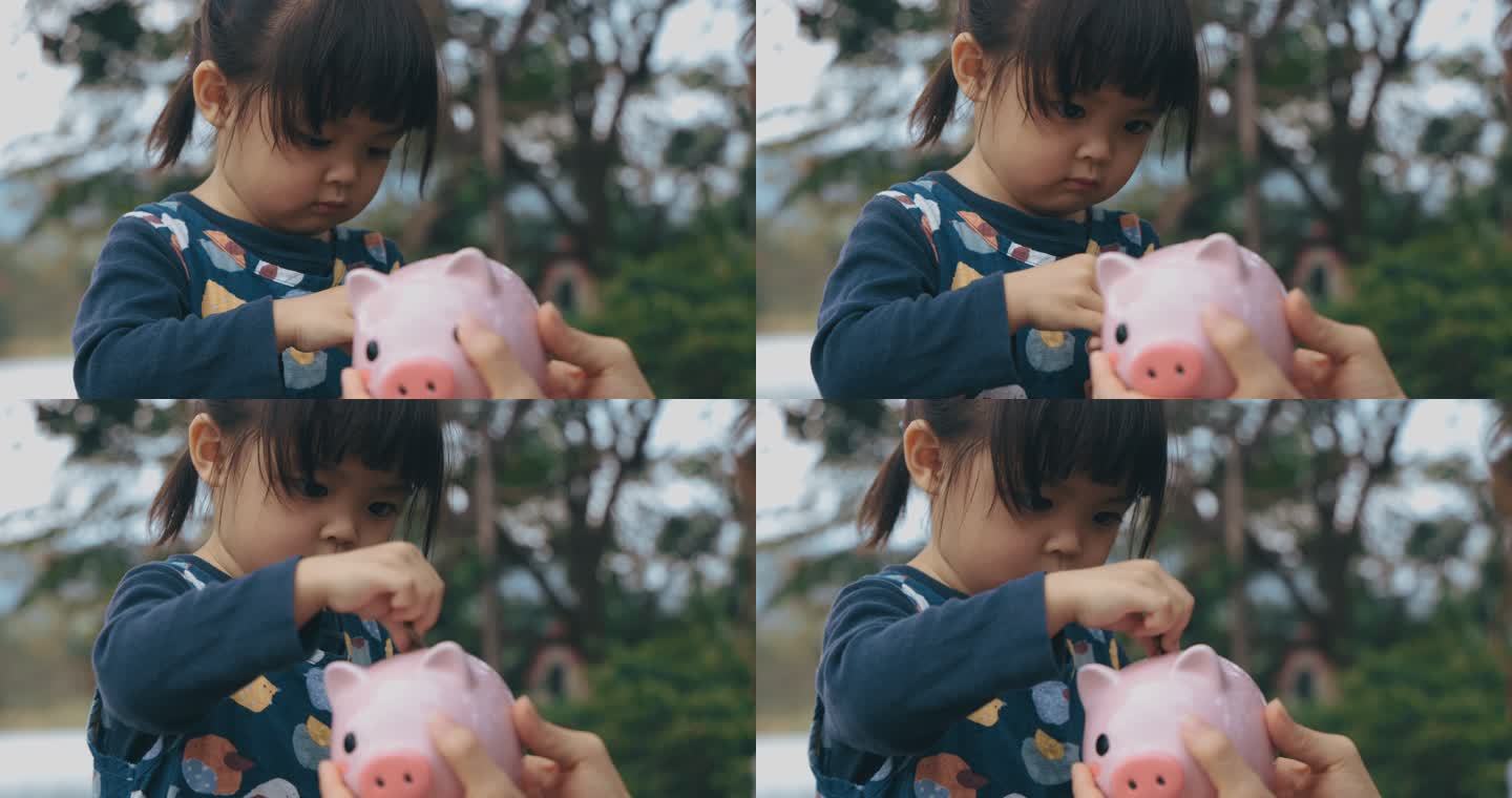 女孩拿着存钱罐小女孩小猪存钱罐理财培育