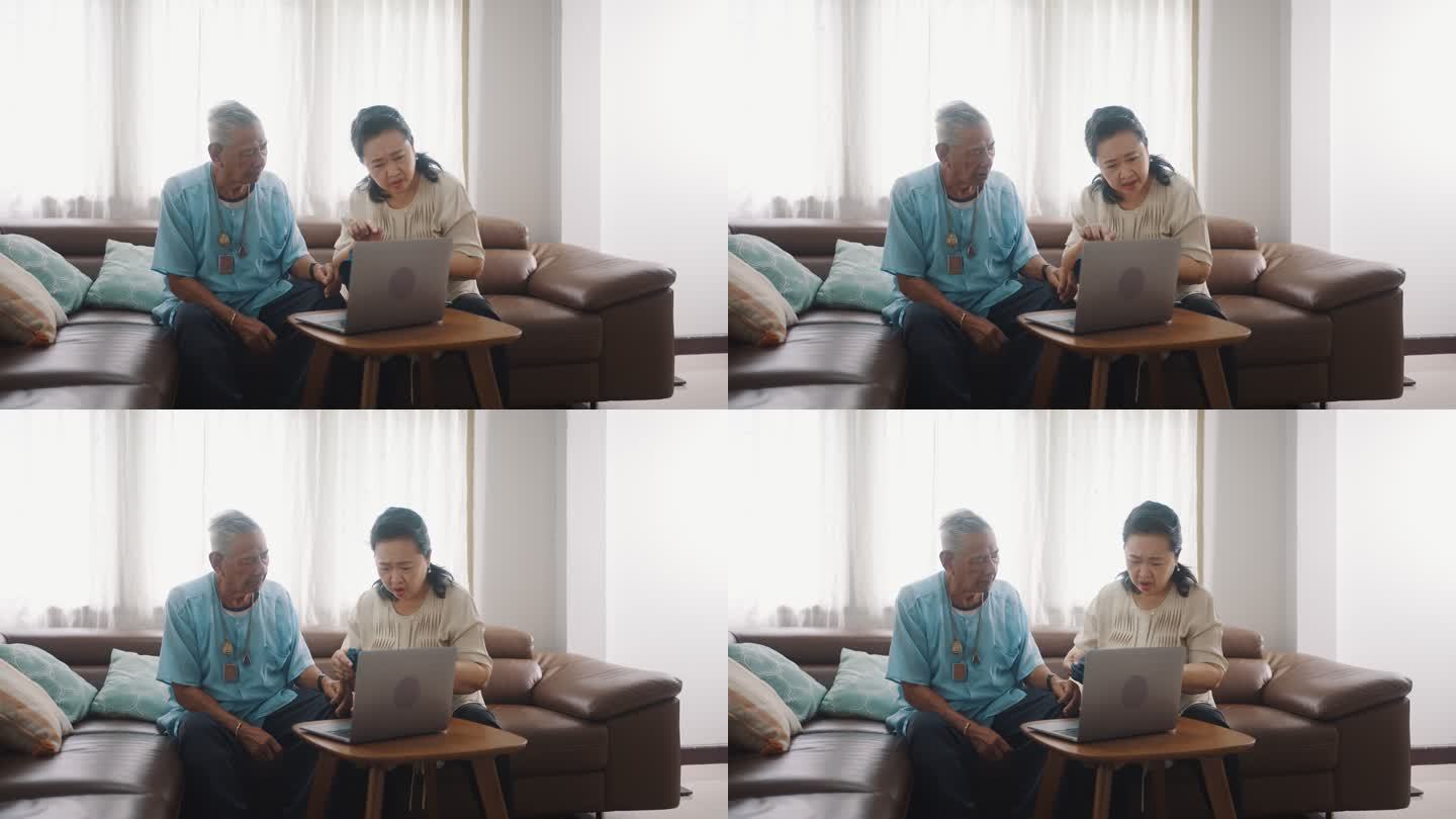 老年夫妇在家里用笔记本电脑与医生视频会议