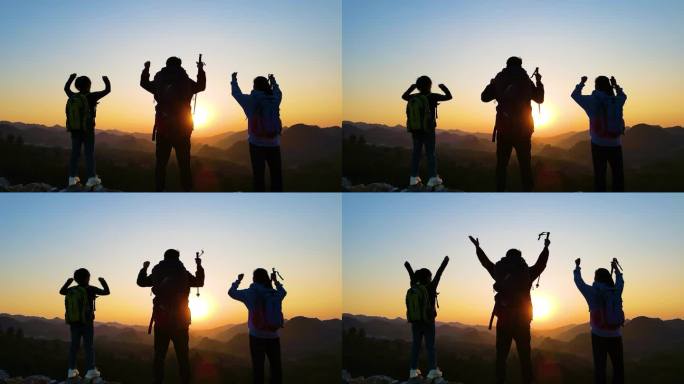 一群少年山顶挥手呐喊户外探险成功登顶登山