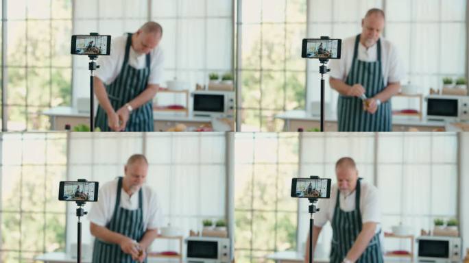 在家中在线举办的虚拟烹饪课活动中，一名老年男子向观众拍摄烹饪节目或博客